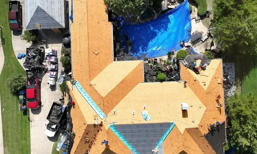 Professional Storm Damage Roof Repair being performed in Forest Lake